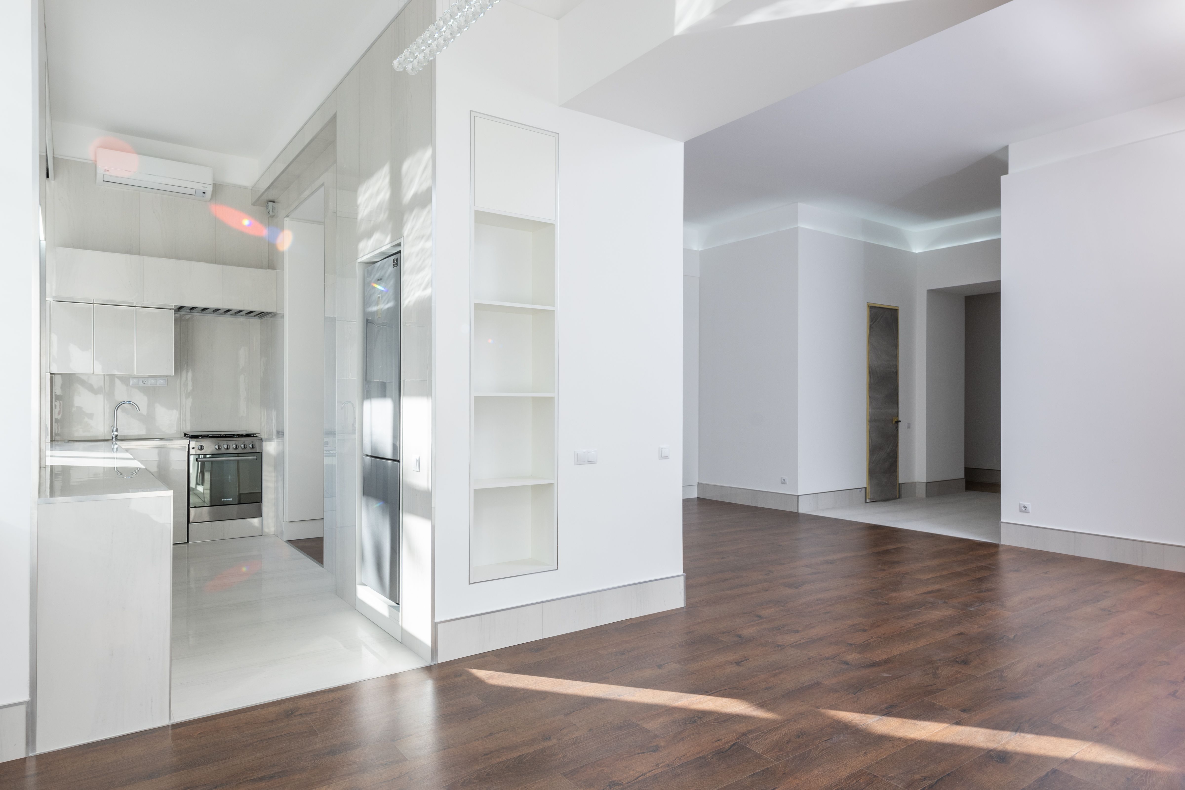 Clean open apartment kitchen and living area ready for showing